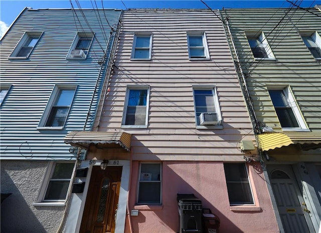 view of building exterior with cooling unit