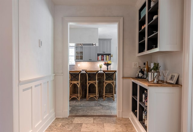 8 Lost Pond Ln, North Salem, NY 10560 - wine area featuring light stone finish floors