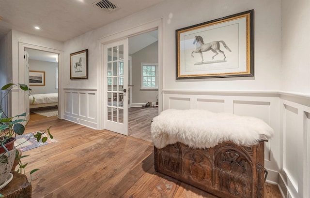 8 Lost Pond Ln, North Salem, NY 10560 - bedroom featuring a decorative wall, wood finished floors, and wainscoting