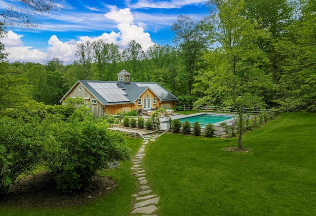 8 Lost Pond Ln, North Salem, NY 10560 - back of property with an outdoor pool, a lawn, and a forest view