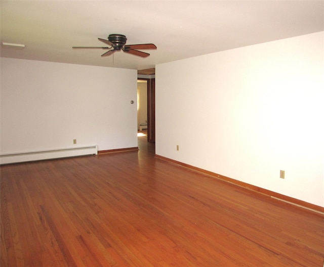 7 Holiday St, Pawling, NY 12564 - empty room featuring wood finished floors, ceiling fan, a baseboard radiator, and baseboards
