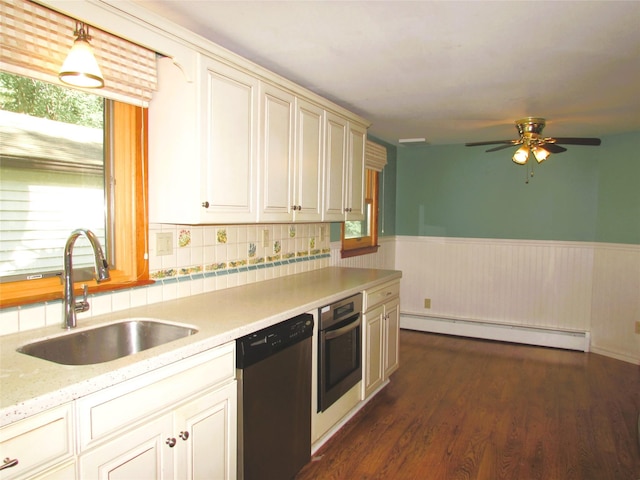 7 Holiday St, Pawling, NY 12564 - kitchen with appliances with stainless steel finishes, baseboard heating, a sink, wainscoting, and dark wood-style floors