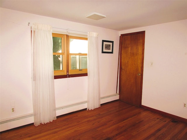 7 Holiday St, Pawling, NY 12564 - unfurnished room with wood finished floors, baseboards, and baseboard heating