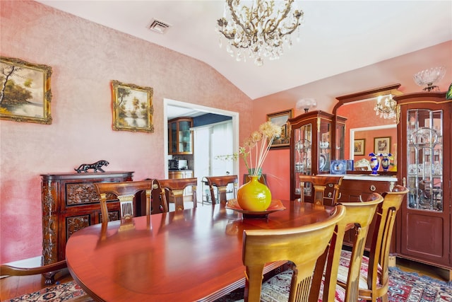 429 E Park Ave, Long Beach, NY 11561 - dining area with a chandelier, lofted ceiling, and wood finished floors