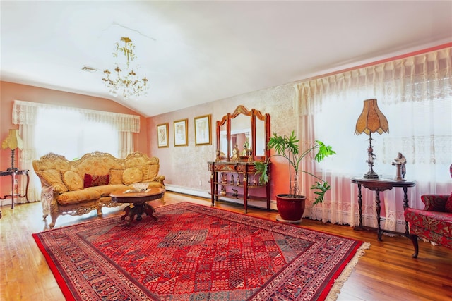 429 E Park Ave, Long Beach, NY 11561 - living area with wood finished floors, vaulted ceiling, a chandelier, and baseboard heating