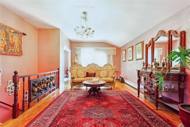 429 E Park Ave, Long Beach, NY 11561 - living area featuring wood finished floors, a chandelier, vaulted ceiling, and baseboards