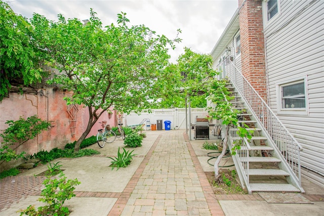 429 E Park Ave, Long Beach, NY 11561 - fenced backyard featuring a patio area and stairway