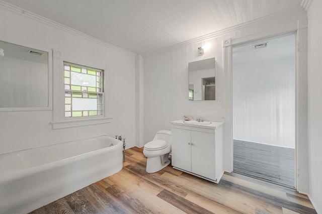 434 Griffing Ave, Riverhead, NY 11901 - full bathroom featuring crown molding, toilet, vanity, wood finished floors, and a tub to relax in