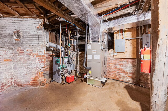 434 Griffing Ave, Riverhead, NY 11901 - unfinished basement with electric panel, a heating unit, heating unit, and brick wall