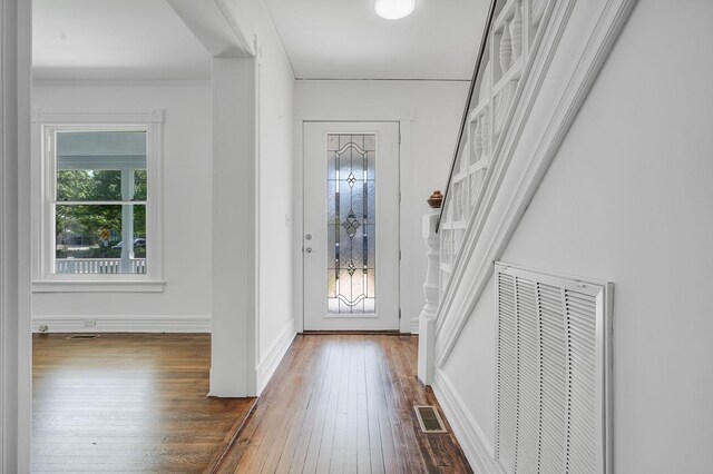 434 Griffing Ave, Riverhead, NY 11901 - entrance foyer with healthy amount of natural light, hardwood / wood-style floors, and baseboards