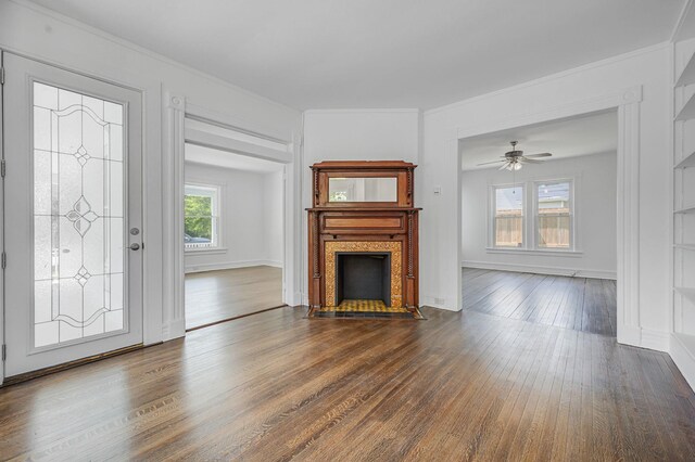 434 Griffing Ave, Riverhead, NY 11901 - unfurnished living room with dark wood-style floors, a fireplace with flush hearth, ceiling fan, and ornamental molding