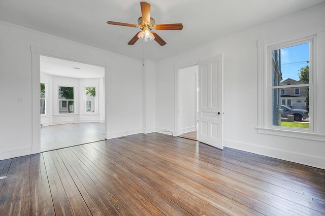 434 Griffing Ave, Riverhead, NY 11901 - spare room with a ceiling fan, plenty of natural light, wood-type flooring, baseboards, and ornamental molding