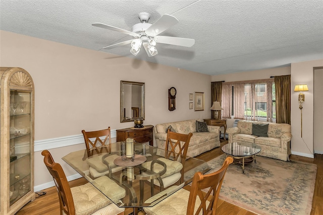 71-14 Sutton Pl Unit 1, Fresh Meadows, NY 11365 - dining area with a textured ceiling, wood finished floors, a ceiling fan, and baseboards