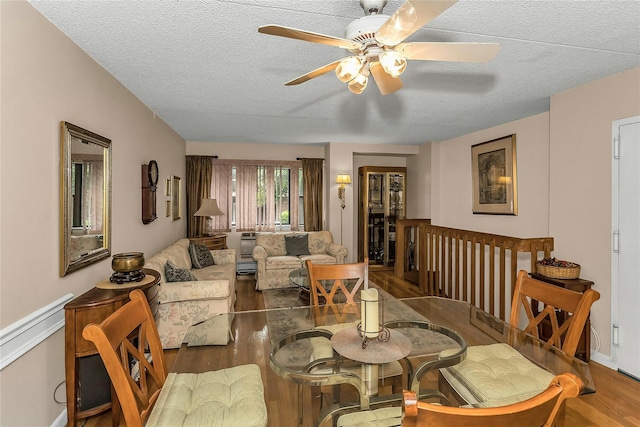 71-14 Sutton Pl Unit 1, Fresh Meadows, NY 11365 - dining space featuring ceiling fan, a textured ceiling, and wood finished floors