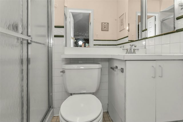 71-14 Sutton Pl Unit 1, Fresh Meadows, NY 11365 - full bath with tile walls, toilet, a shower stall, vanity, and wainscoting