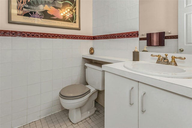 71-14 Sutton Pl Unit 1, Fresh Meadows, NY 11365 - bathroom with tile walls, toilet, vanity, and tile patterned floors