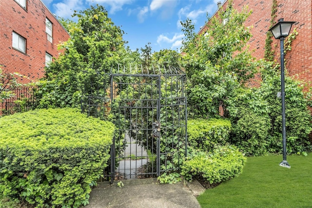71-14 Sutton Pl Unit 1, Fresh Meadows, NY 11365 - view of yard featuring a gate