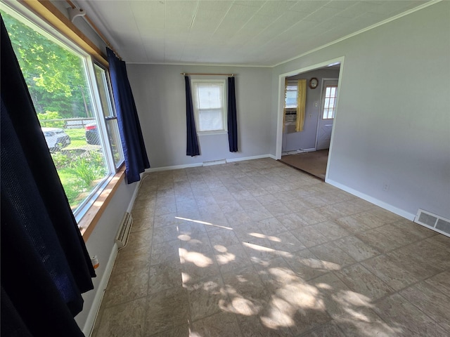 73 Barcelow St, Port Jervis, NY 12771 - unfurnished room featuring healthy amount of natural light, crown molding, and baseboards