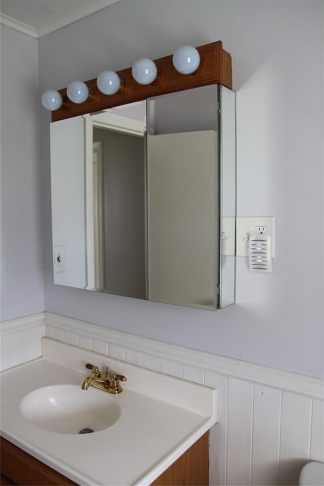 73 Barcelow St, Port Jervis, NY 12771 - bathroom featuring vanity and ornamental molding