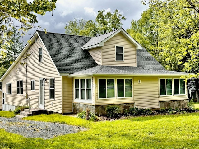674 Sackett Lake Rd, Monticello, NY 12701 - rear view of house with roof with shingles and a yard