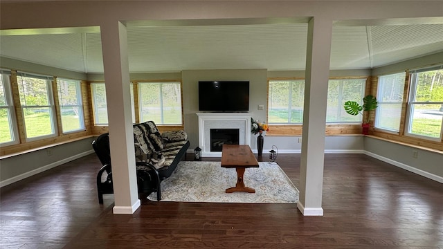 674 Sackett Lake Rd, Monticello, NY 12701 - living area with healthy amount of natural light, dark wood finished floors, and baseboards
