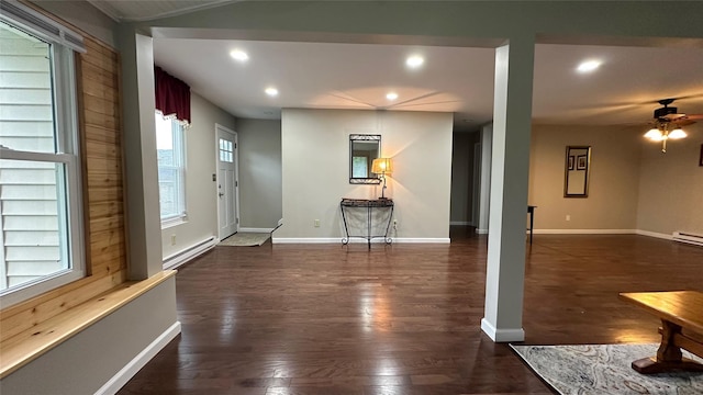 674 Sackett Lake Rd, Monticello, NY 12701 - entrance foyer featuring baseboard heating, dark wood-type flooring, ceiling fan, recessed lighting, and baseboards