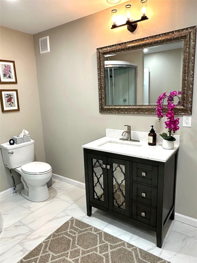 674 Sackett Lake Rd, Monticello, NY 12701 - bathroom featuring marble look tiles, vanity, baseboards, and toilet