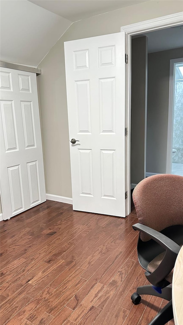 674 Sackett Lake Rd, Monticello, NY 12701 - office with dark wood-style flooring, vaulted ceiling, and baseboards