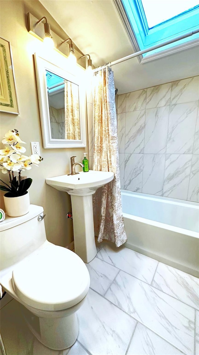 674 Sackett Lake Rd, Monticello, NY 12701 - full bathroom with marble look tiles, shower / bath combination with curtain, a skylight, and toilet