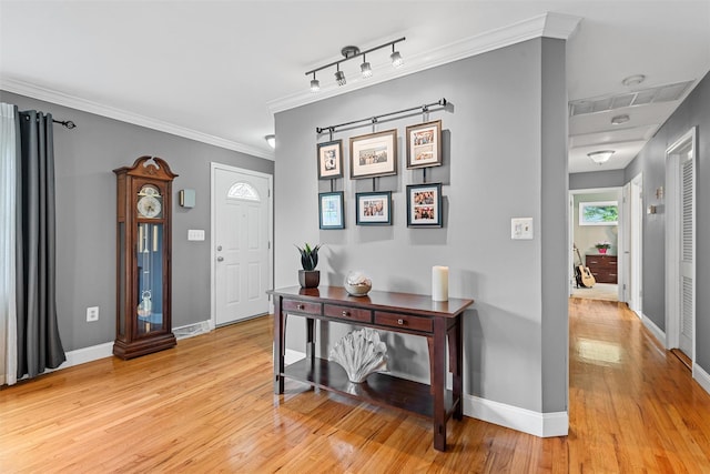 7 Lincoln Dr, Washingtonville, NY 10992 - entrance foyer with light wood-style floors, baseboards, and crown molding