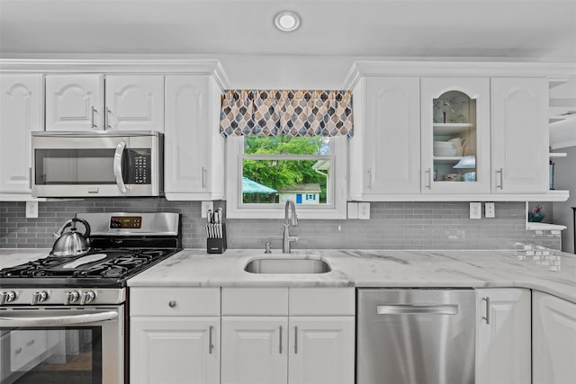 7 Lincoln Dr, Washingtonville, NY 10992 - kitchen featuring appliances with stainless steel finishes, a sink, backsplash, white cabinetry, and recessed lighting