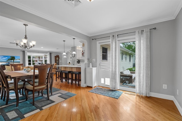 7 Lincoln Dr, Washingtonville, NY 10992 - dining space featuring a chandelier, wood finished floors, baseboards, and crown molding
