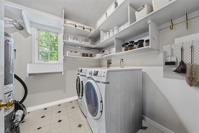7 Lincoln Dr, Washingtonville, NY 10992 - laundry room with washing machine and dryer, baseboards, water heater, and light tile patterned floors