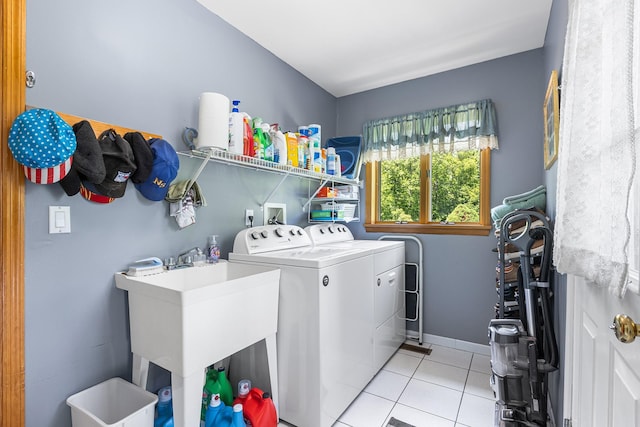 50 Stallion Trl, Brewster, NY 10509 - laundry area featuring washing machine and dryer and light tile patterned floors