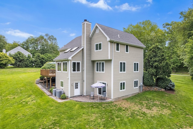 50 Stallion Trl, Brewster, NY 10509 - back of house with a chimney, a yard, a patio, and a wooden deck