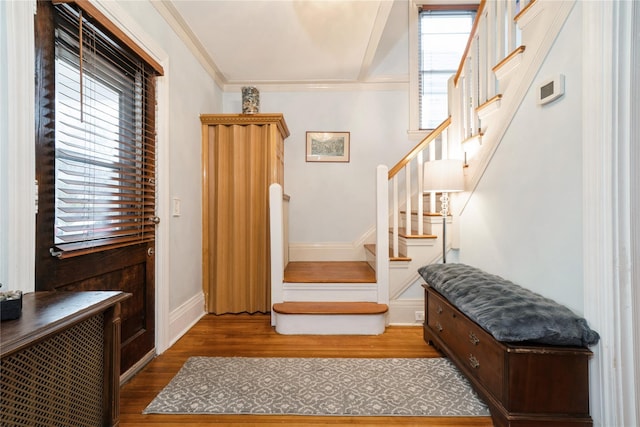 11 Bridge St, Suffern, NY 10901 - entryway featuring stairway, wood finished floors, and ornamental molding