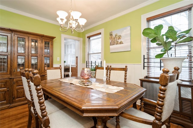 11 Bridge St, Suffern, NY 10901 - dining space featuring a chandelier, a wainscoted wall, ornamental molding, and wood finished floors