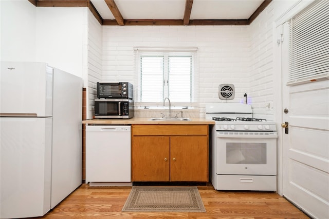 11 Bridge St, Suffern, NY 10901 - kitchen with white appliances, light wood-style flooring, light countertops, and beamed ceiling