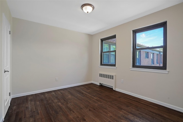 127 Beacon Hill Dr Unit F 13, Dobbs Ferry, NY 10522 - unfurnished room featuring radiator, dark wood-style floors, and baseboards