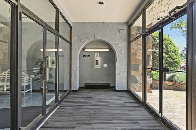 25 Lake St Unit 7K & 7L, White Plains, NY 10603 - unfurnished sunroom featuring arched walkways
