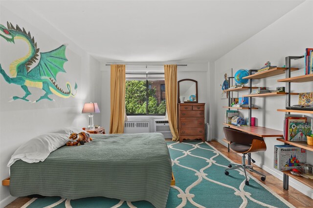 25 Lake St Unit 7K & 7L, White Plains, NY 10603 - bedroom with radiator and wood finished floors