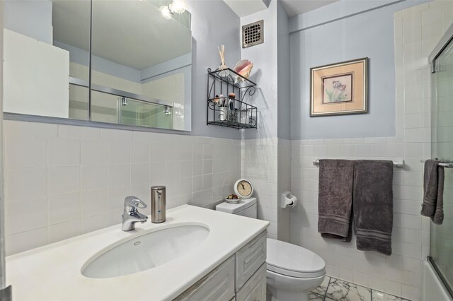 25 Lake St Unit 7K & 7L, White Plains, NY 10603 - bathroom featuring toilet, tile walls, and vanity