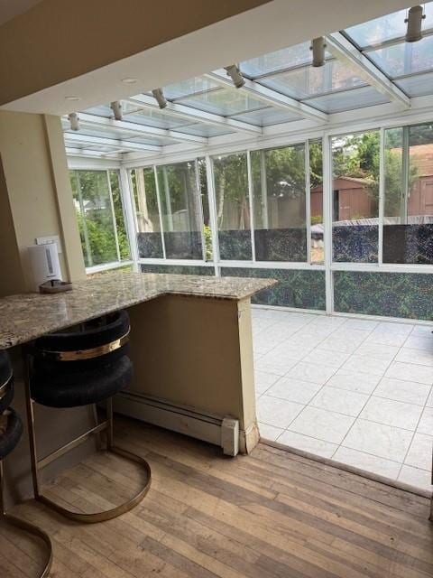 47 Myson St, West Islip, NY 11795 - sunroom featuring a baseboard heating unit, hardwood / wood-style flooring, and healthy amount of natural light