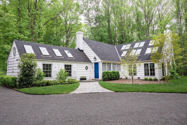 149 Washington Spring Rd, Palisades, NY 10964 - new england style home with a chimney, roof with shingles, and a front yard