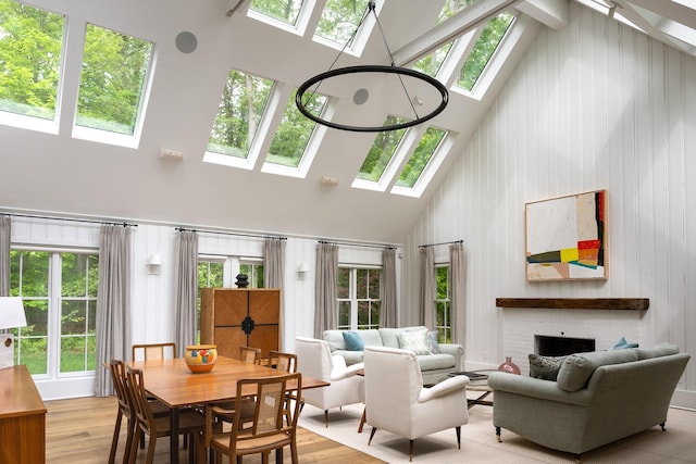 149 Washington Spring Rd, Palisades, NY 10964 - dining room with a skylight, high vaulted ceiling, a brick fireplace, and plenty of natural light