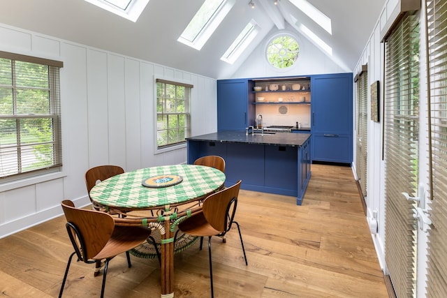 149 Washington Spring Rd, Palisades, NY 10964 - dining room with a skylight, a decorative wall, and light wood finished floors