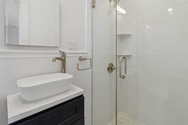 565 Broadway Unit 6B, Hastings-On-Hudson, NY 10706 - bathroom with a shower stall, tile walls, and vanity