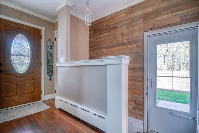 102 Barbara St, Staten Island, NY 10306 - foyer entrance featuring a baseboard heating unit, healthy amount of natural light, wood finished floors, ornamental molding, and wood walls