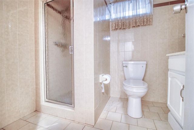 102 Barbara St, Staten Island, NY 10306 - bathroom featuring tile walls, a stall shower, tile patterned floors, and toilet