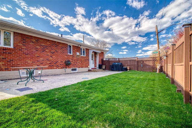 102 Barbara St, Staten Island, NY 10306 - back of property featuring a patio area, brick siding, and entry steps